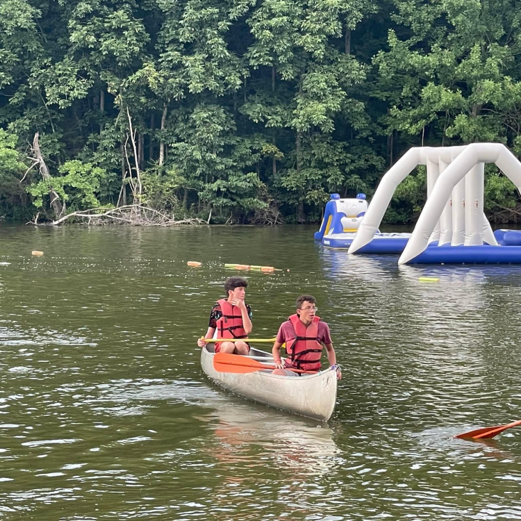  Boys canoeing on the lake at 4-H camp